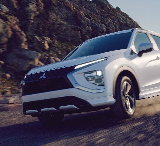 A white 2026 Mitsubishi Eclipse Cross compact SUV with Active Yaw Control (AYC)