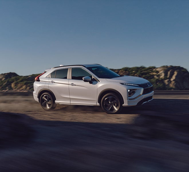A white 2026 Mitsubishi Eclipse Cross compact SUV with 3 drive modes