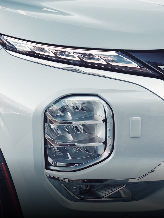 Close up on 2026 Mitsubishi Outlander SUV LED running lights and turn signals