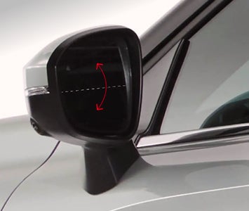 Close up on the available reverse auto tilt door mirrors for the 2026 Mitsubishi Outlander SUV