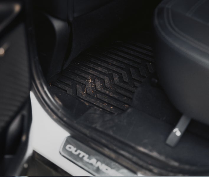Close up on installed 2026 Mitsubishi Outlander SUV Trail Edition branded all weather floor mats
