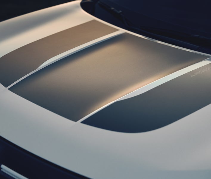 Close up on the 2026 Mitsubishi Outlander SUV Trail Edition black hood graphics