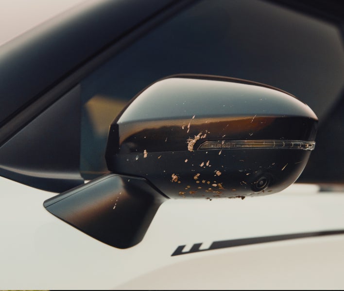 Close up on the 2026 Mitsubishi Outlander SUV Trail Edition black mirror covers